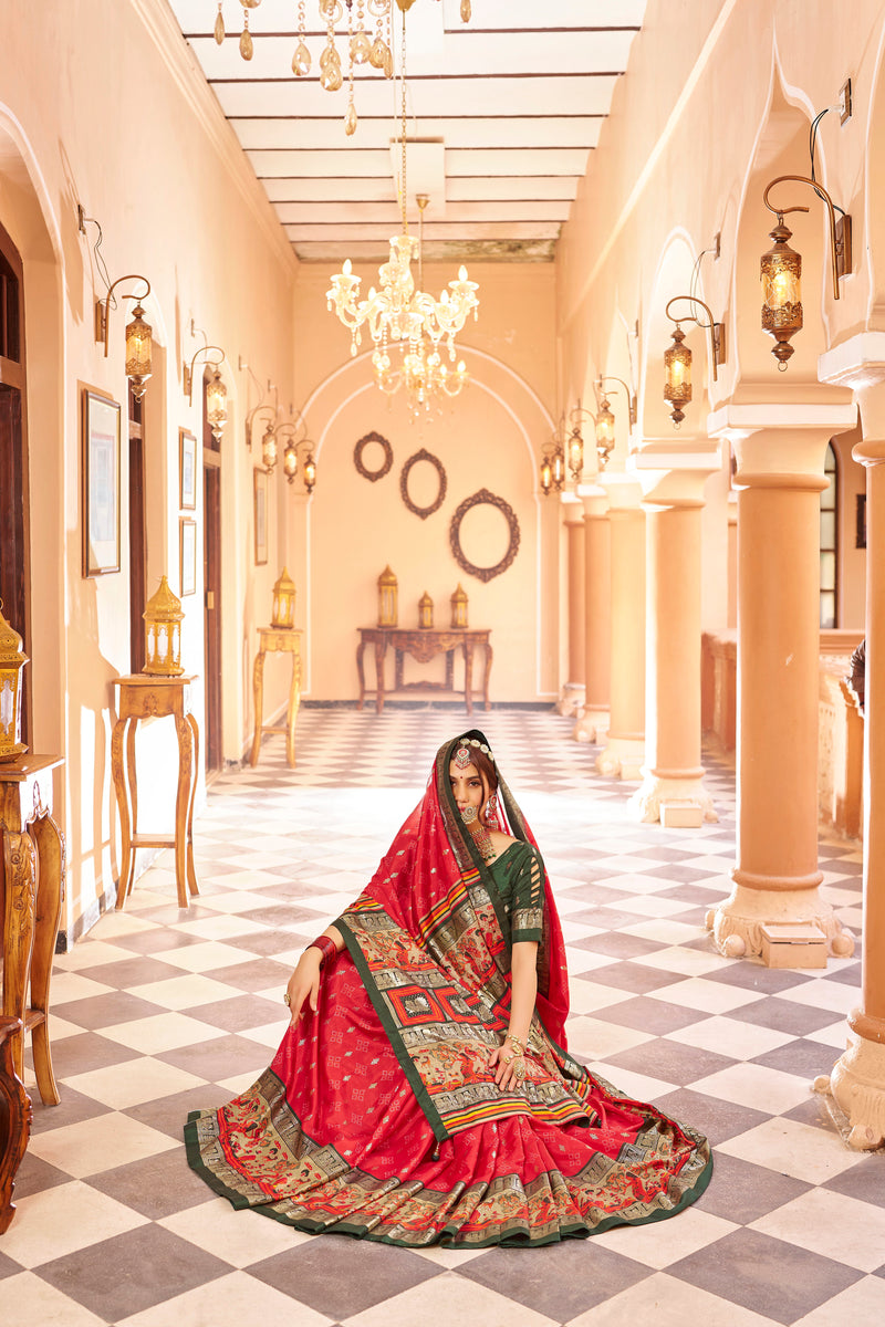 Red color patola silk saree with foil printed work