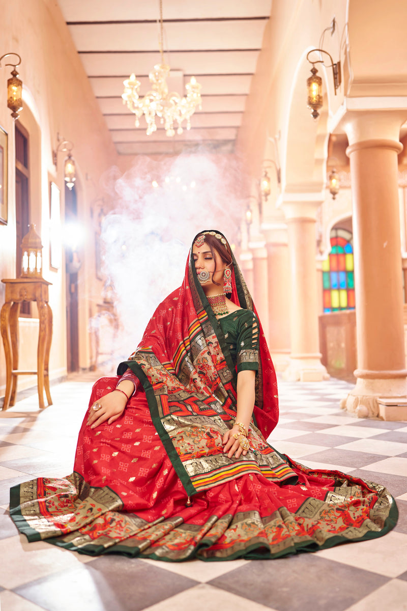 Red color patola silk saree with foil printed work