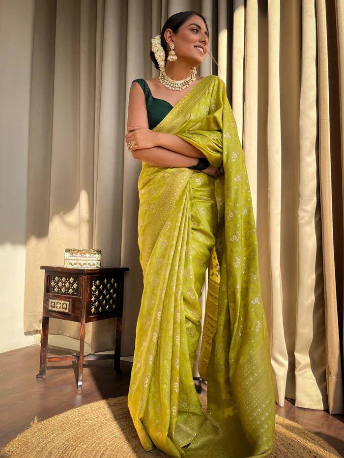 LIGHT MEHENDI GREEN PURE SOFT SILK SAREE WITH TWIRLING BLOUSE PIECE